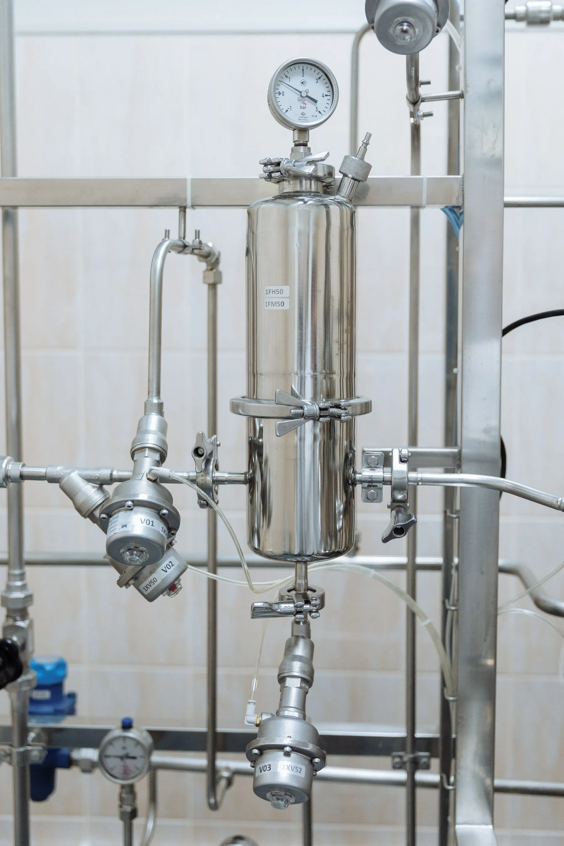 Stainless steel pipework and pressure gauges on a water purification system