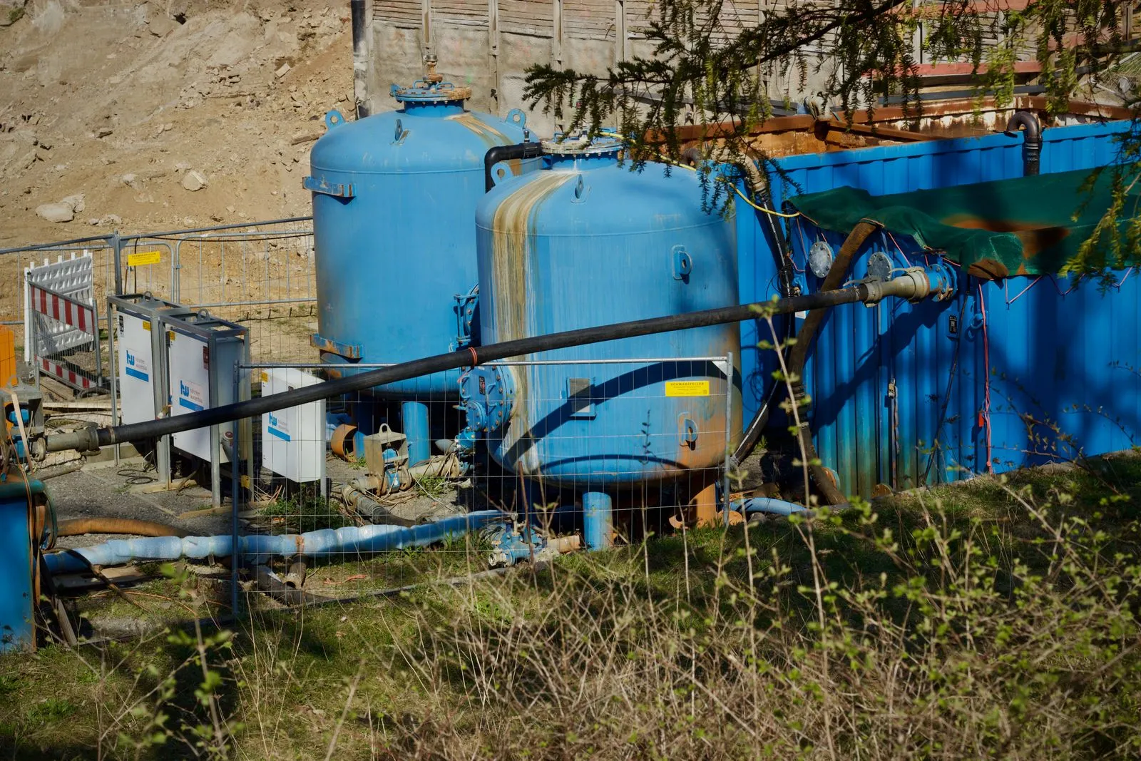 Industrial water filtration vessels outside a treatment plant